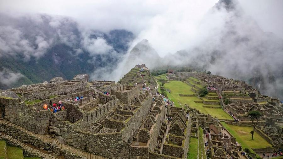 Machu Picchu ruins in the misty Andes, Peru