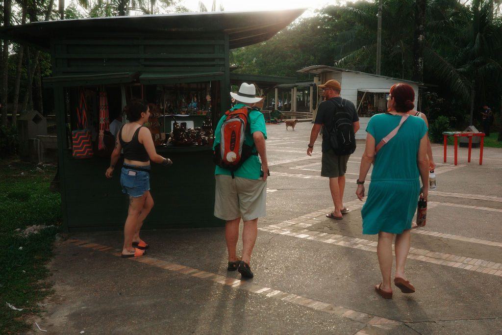 Travelers browsing a local artisan market