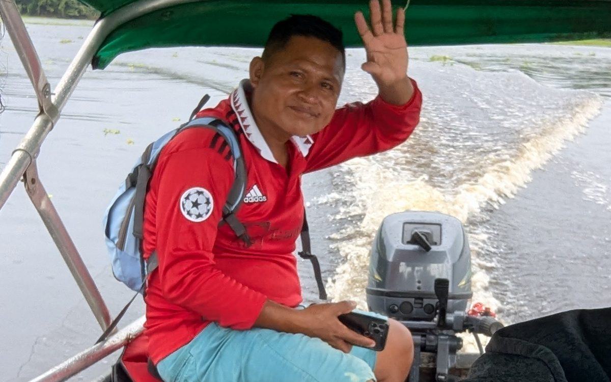 Our local partner Fran waves from the back of the boat